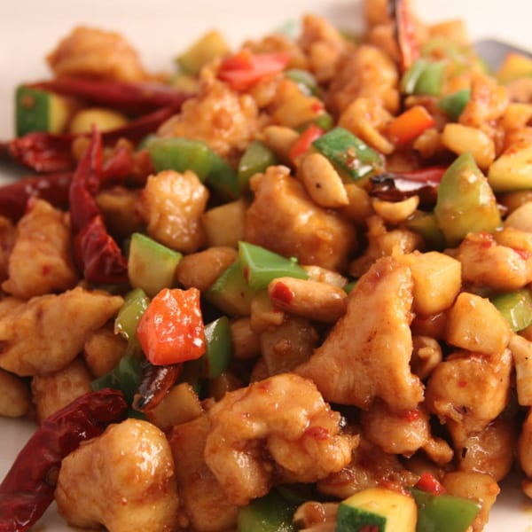 Kung Pao chicken with peanuts, red chili peppers, and green and red bell peppers.